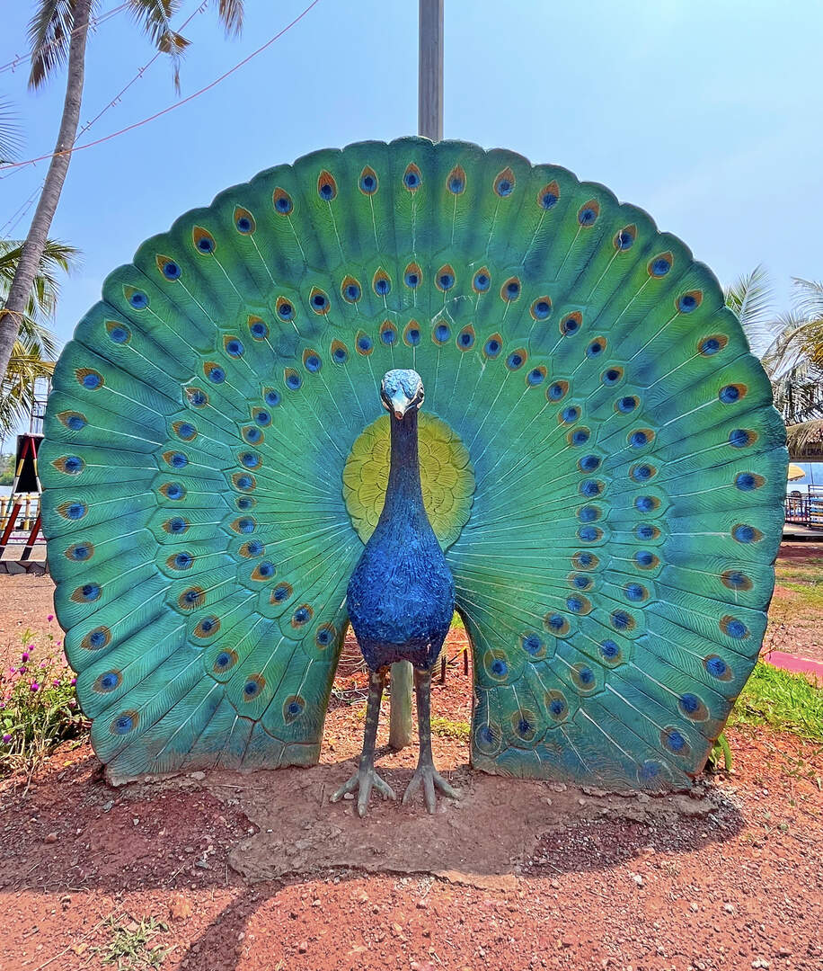 Peacock statue in Lake View Palace Akalappuzha Park